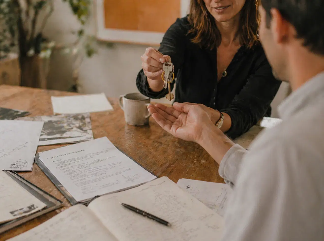 People reviewing documents to manage a rental